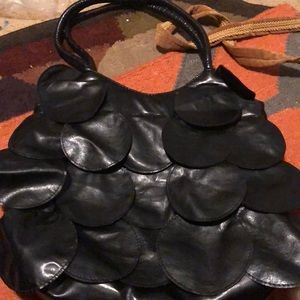 Circles, black leather bag